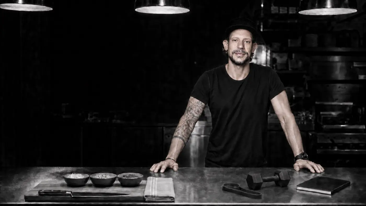Alex at the pass in a professional kitchen