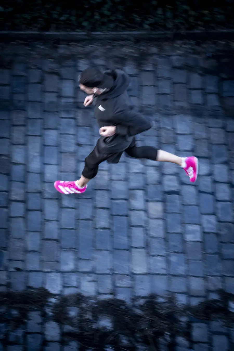 Running on cobblestones, shot from above