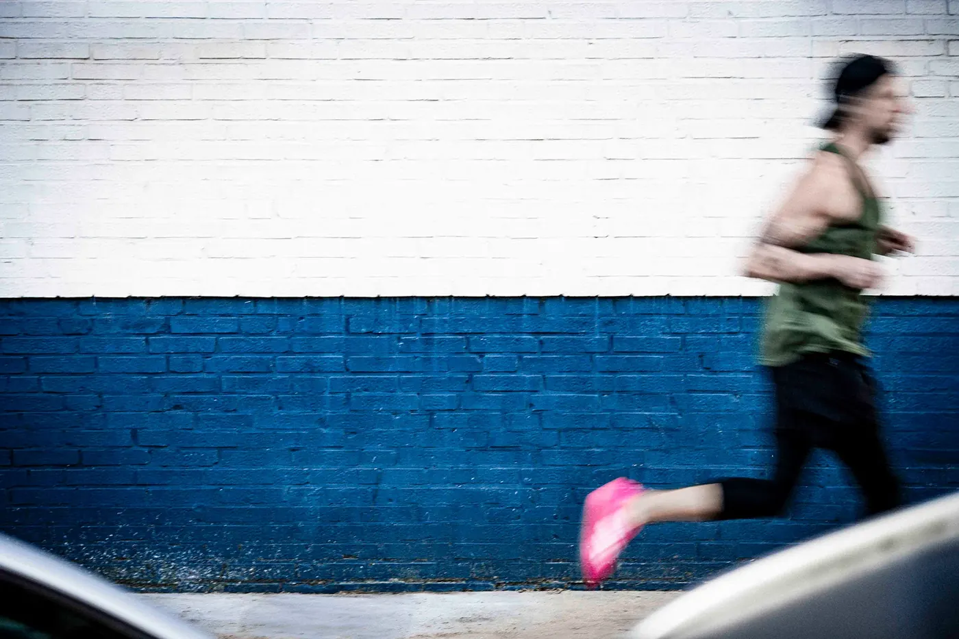 Alex running along a wall